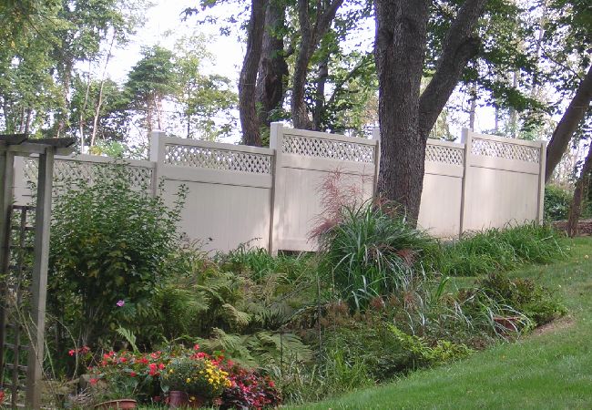 An ActiveYards PVC panel fence built on a slope.