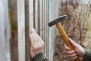 Wood fences may need panels replaced if they are damaged.