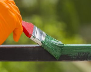 Decide whether it's best to repaint or replace your fence.