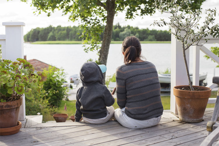 family sitting on patio steps