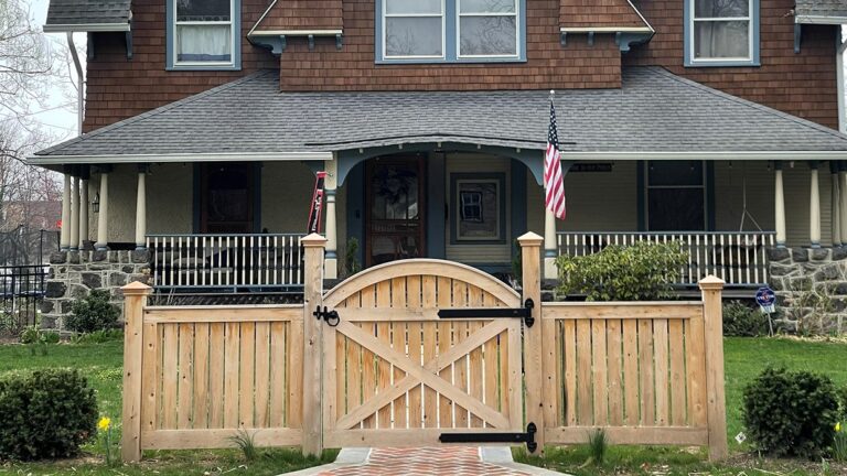 Woodend gate in front of a house