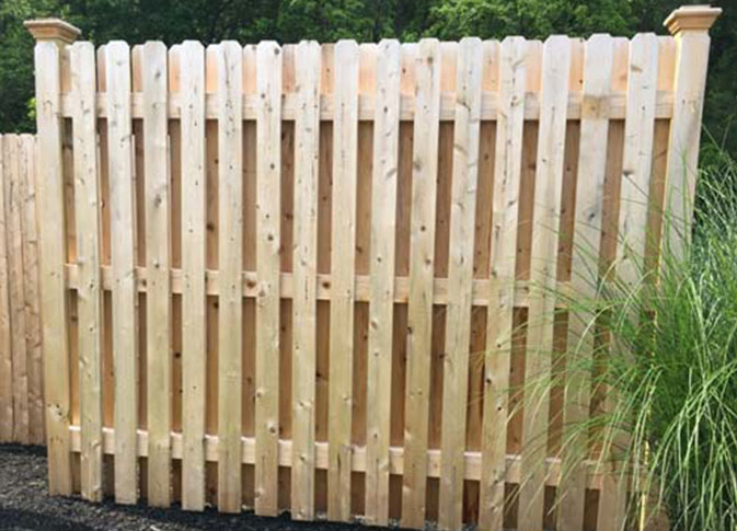 Semi-private cedar wood shadowbox fence with 1" x 4" pickets and 33 pickets per panel