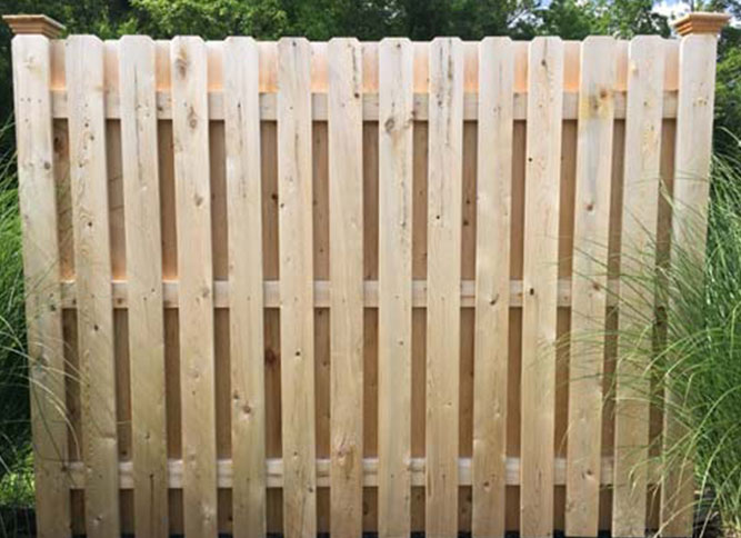 Semi-private cedar wood shadowbox fence with 1" x 5" pickets and 13 pickets per panel